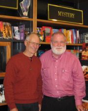 Giving forth with two generations of booksellers to his left